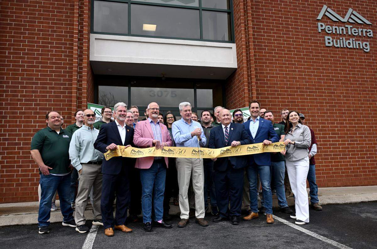 PennTerra Engineering President John Sepp cuts a ribbon celebrating the 50th anniversary of the company surrounded by local officials and the PennTerra team on Wednesday, April 1, 2026. 