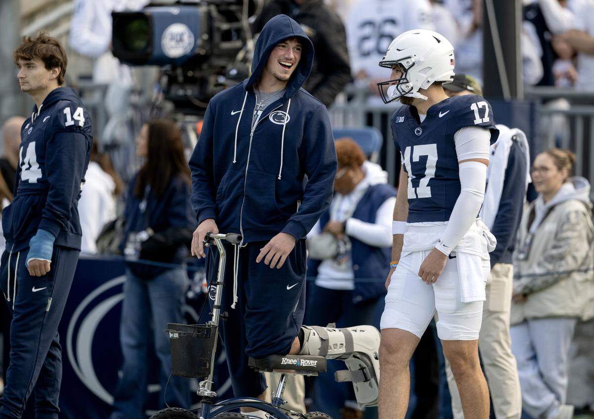 Penn State QB Drew Allar, left, talks with Ethan Grunkemeyer (17) during warmups for the game against Indiana on Saturday, Nov. 8, 2025. 