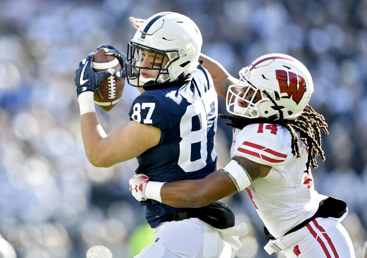 Penn State tight end Pat Freiermuth makes a catch ahead of Wisconsin’s D’Cota Dixon for a first down during the game on Saturday, Nov. 10, 2018.