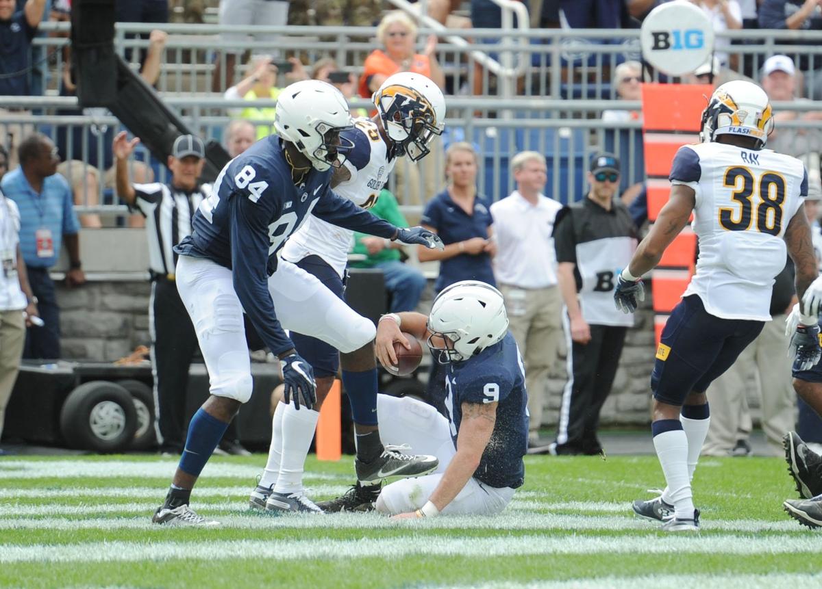 Penn State quarterback Trace McSorley slides into the end zone to score a touchdown during a game against Kent State Saturday, Sept. 15, 2018 at Beaver Stadium.
