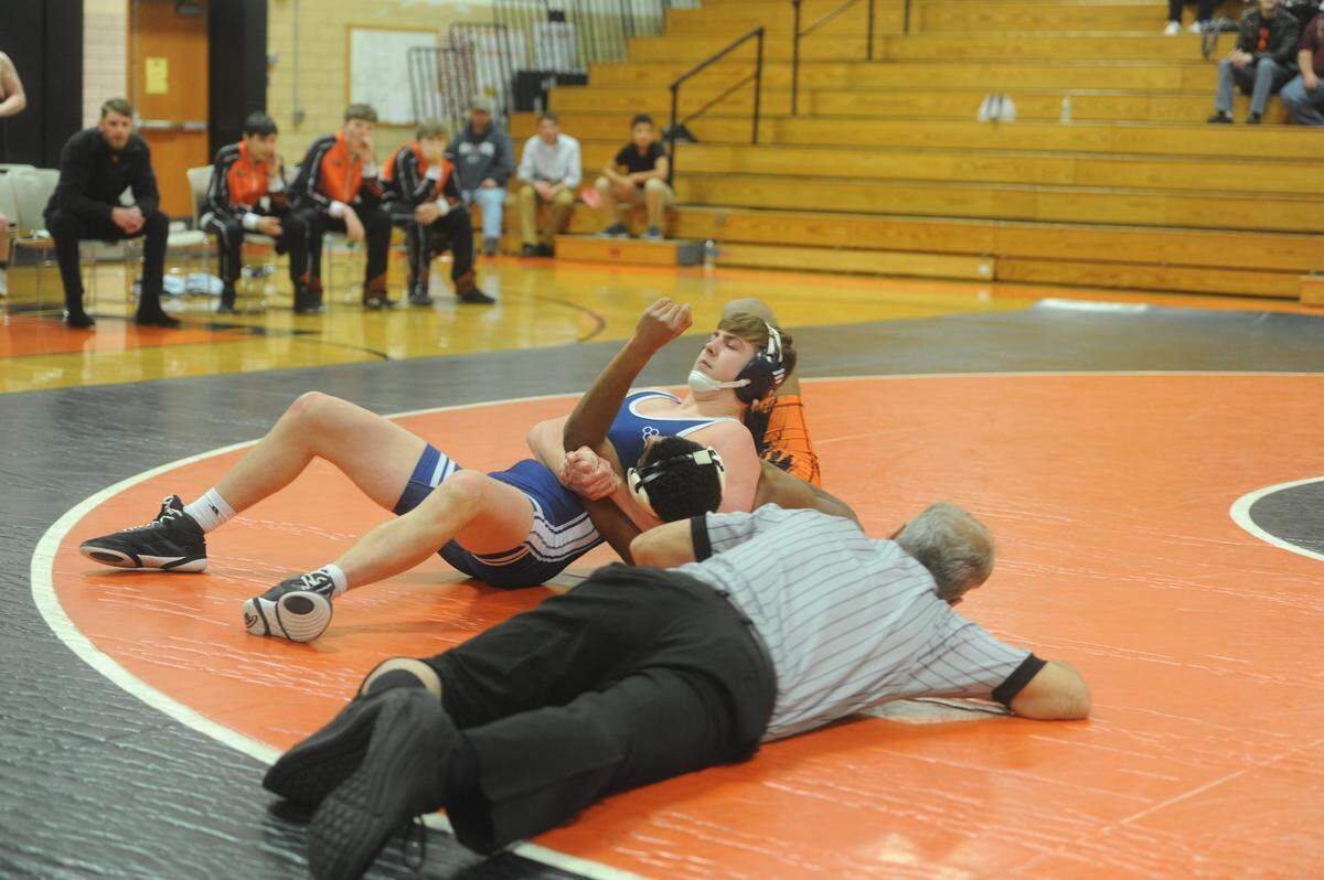Penns Valley’s Brandon Corl aims to pin Tyrone’s Jermaine Myers in their 172-pound bout during the Rams’ 39-31 loss on Tuesday. Corl pinned Myers in 3:29 to make his Penns Valley dual debut.