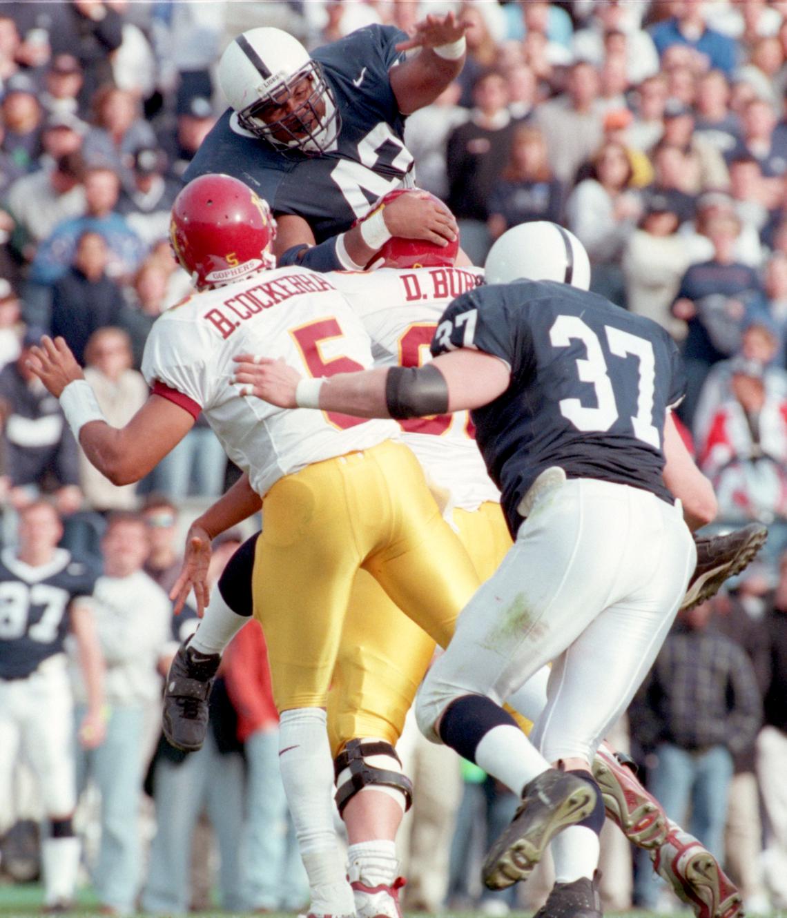 Penn State's  Brandon Short (43)  pressures  Minnesotaquarterback Billy  Cockerham (5) in the fourth quarter of their gameon Saturday, Nov. 6, 1999.  (37) Justin Kurpeikis.