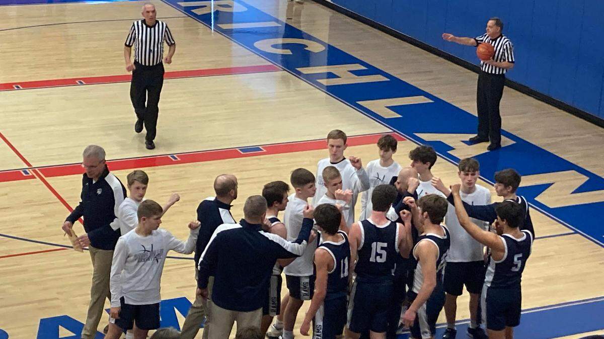 Penns Valley boys basketball team huddles during a timeout in Saturday’s District 6 3A playoff game against Richland.