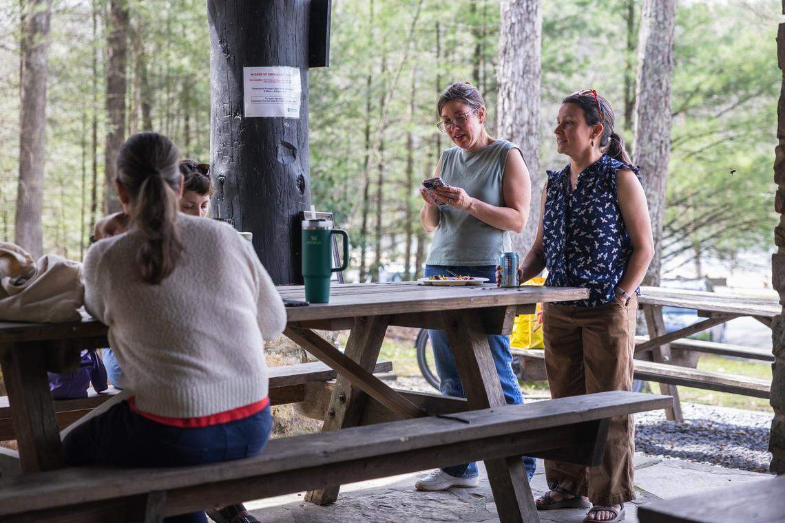ClearWater Conservancy volunteers gather at Whipple Dam State Park in Petersburg, Pa., on Saturday, April 18, 2026, after a day of collecting trash. The organization coordinated cleanup efforts across Centre County, where volunteers collected trash from public green spaces and later came together for a potluck.