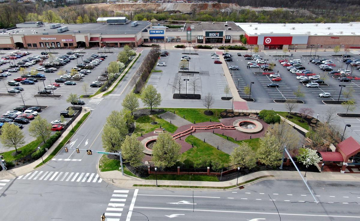 Parts of the parking lot at Colonnade at State College are busy as Wegmans’ and Target are open but others continue to be closed due to the coronavirus shutdown on Friday, May 1, 2020.
