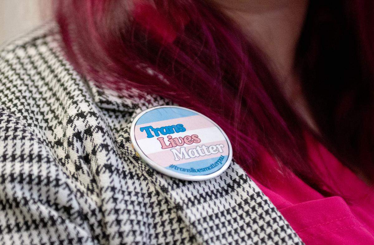 Michel Lee Garrett wears a “Trans Lives Matter” pin on Thursday, Feb. 20, 2025.