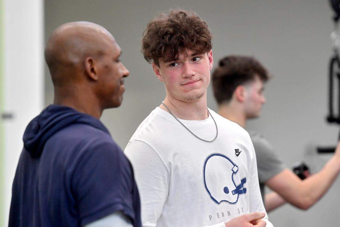 Penn State quarterback Drew Allar talks to coaches and players during weight lifting session on Thursday, March 2, 2023.