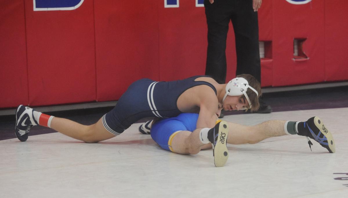 Philipsburg-Osceola’s Caleb Hummel looks to finish off a takedown of Wilson’s Santino Micci in their 107-pound 7th-place match of the Ultimate Warrior Tournament on Saturday, January 28, 2023. Hummel shut out Micci, 2-0.