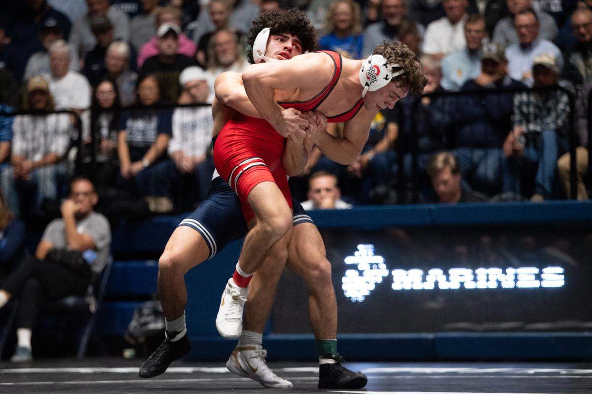Beau Bartlett, back, lifts Jesse Mendez, front, in a 141-pound bout for the NWCA All-Star Classic at Rec Hall on Saturday, Nov. 16, 2024. Mendez won the bout 4-1.