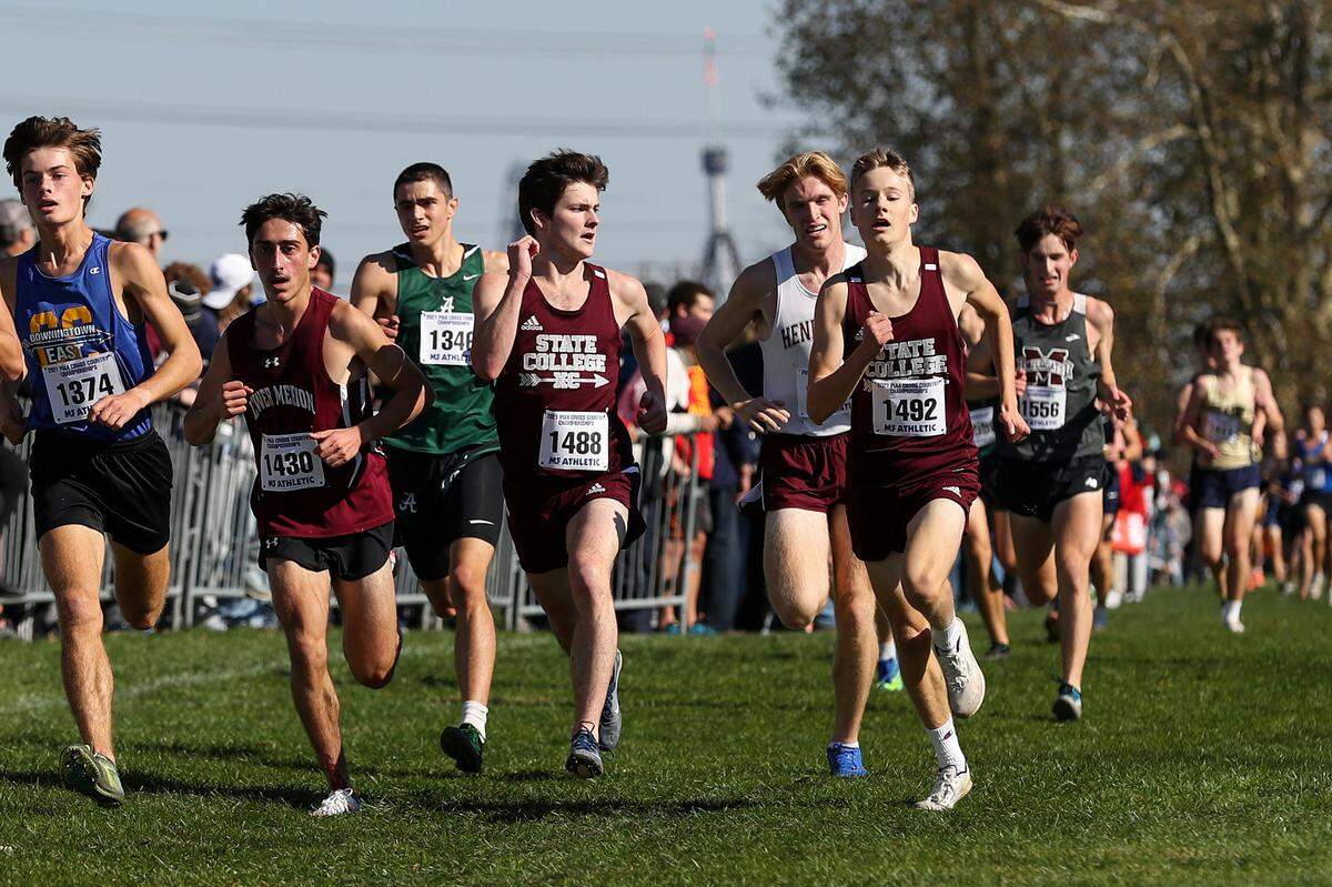 State College’s Charles Endres, fourth from left, and teammate Nick Sloff, right, run toward the finish in the boys 3A race of the PIAA State Cross Country Championships held Saturday at Parkland Cross Country Course in Hershey, PA.Matthew O’Haren/For the Centre Daily Times