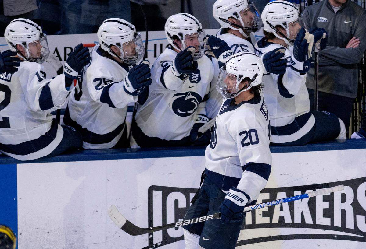 Penn State’s Ture Linden high-fives teammates after his goal in the second period of the game against Michigan on Friday, Nov. 4, 2022 at Pegula Ice Arena.
