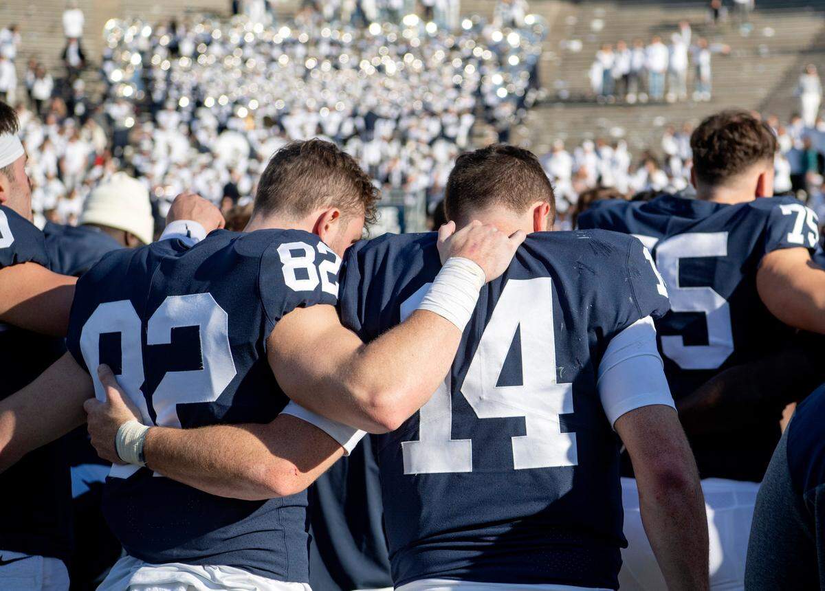 Penn State wide receiver Liam Clifford comforts his brother quarterback Sean Clifford after the loss to Ohio State on Saturday, Oct. 29, 2022.