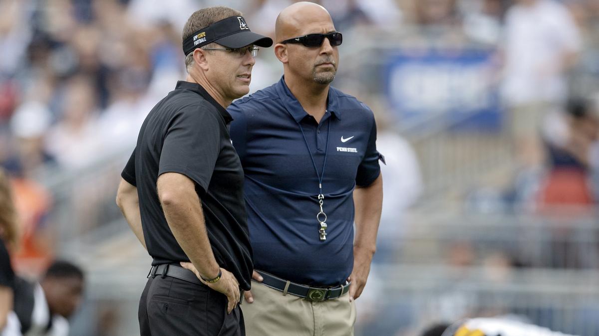 Appalachian State coach Scott Satterfield and Penn State coach James Franklin talk as they watch their players warm up before the game at Beaver Stadium on Saturday, Sept. 1, 2018.