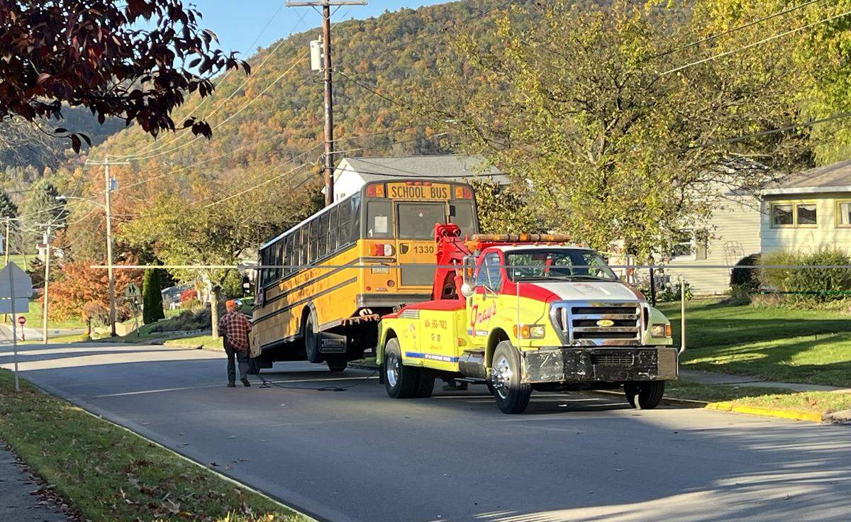 A Bellefonte Area School District bus is towed from a crash on East High Street and McAllister Street on Tuesday, Oct. 28, 2025.