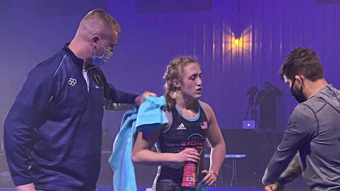 Bald Eagle Area’s Grace Stem listens into coach Mark McKnight and Eagles’ assistant coach Kyle Wallace during her match with Elleni Johnson on Tuesday night during the Nittany Lion Wrestling Club’s 5th event. Stem topped the No. 6 nationally ranked Johnson 7-4.
