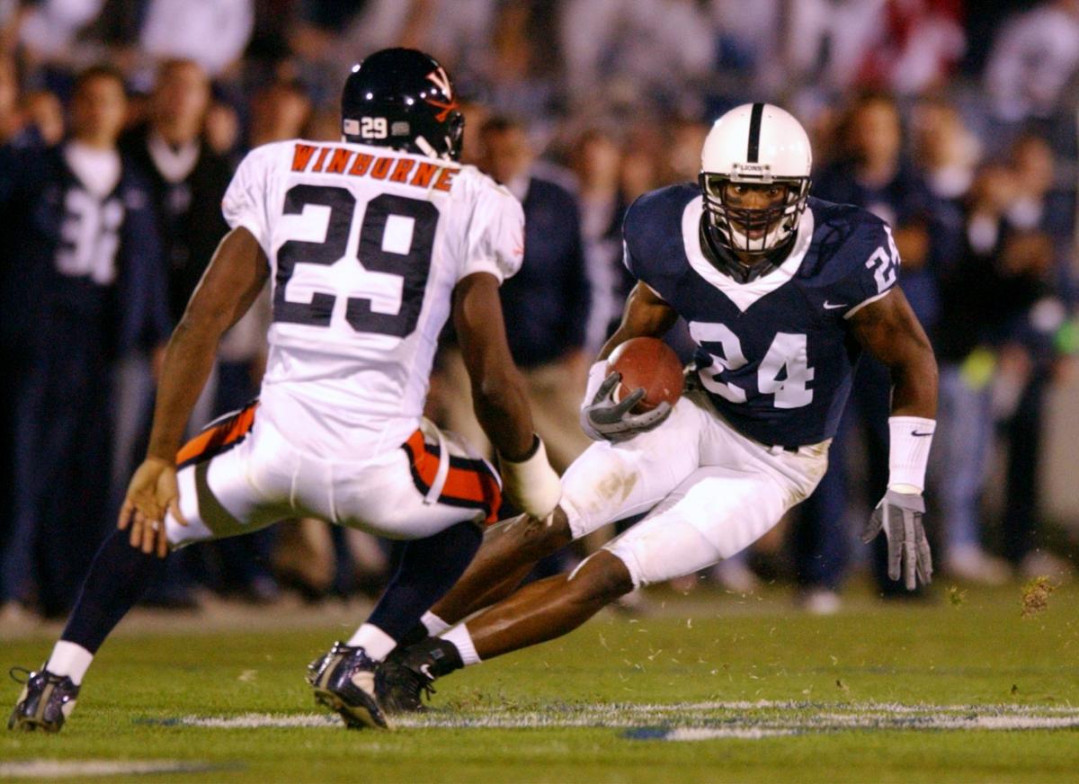 Penn State’s Bryant Johnson (24) tries to cut past Virginia’s Jamaine Winborne (29) after catching a pass, Saturday, Nov. 9, 2002.