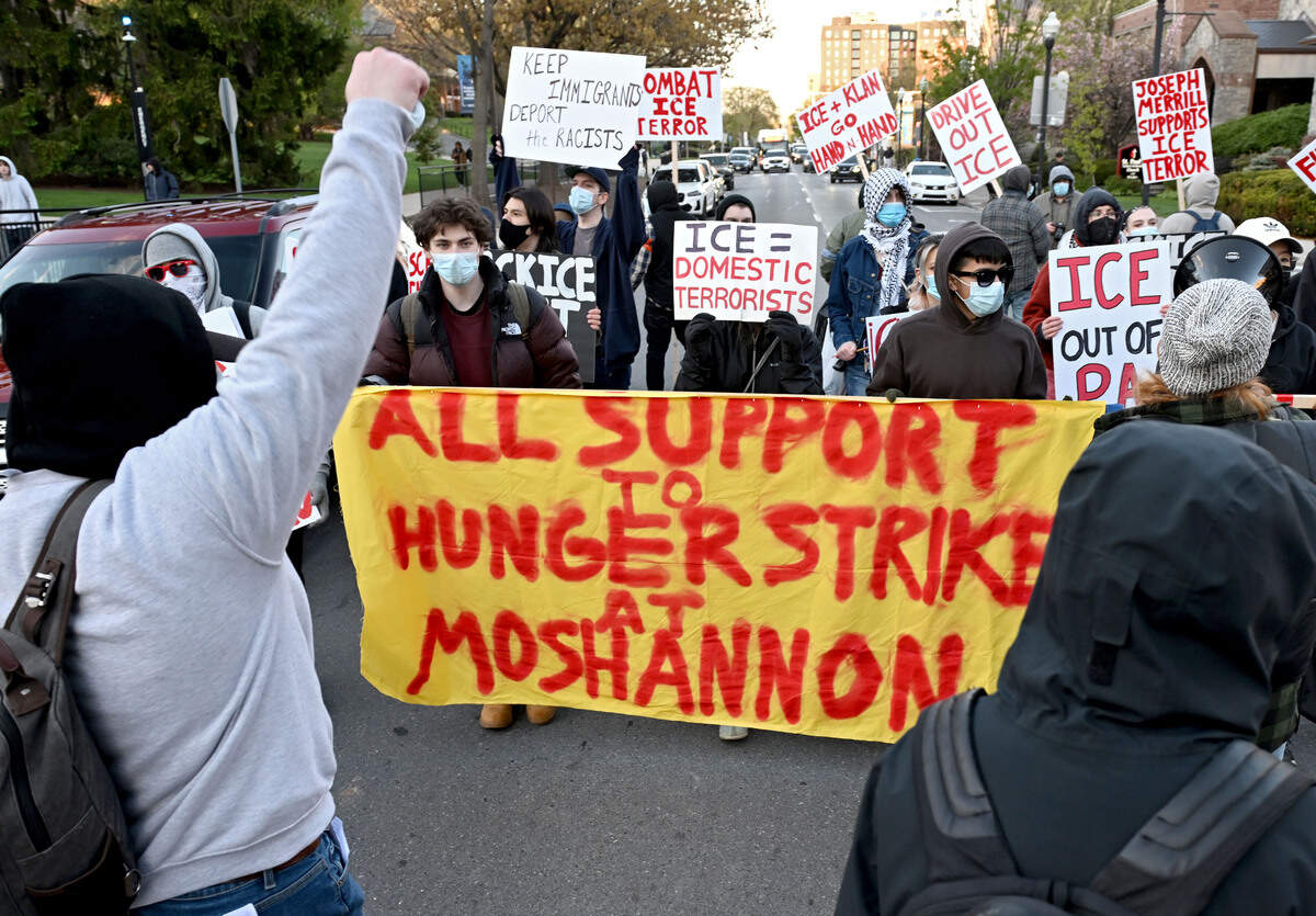 ICE protesters block traffic along College Avenue on Monday, April 20, 2026.  