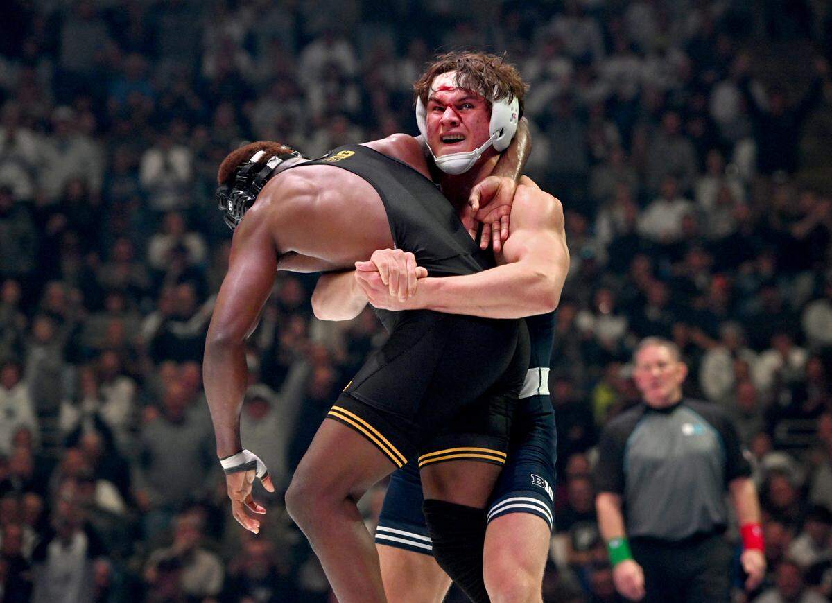 Penn State’s Tyler Kasak holds Iowa’s Jacori Teemer as the clock runs down in the 157-pound bout of the match on Friday, Jan. 31, 2025 at the Bryce Jordan Center. Kasak won by decision, 5-2.