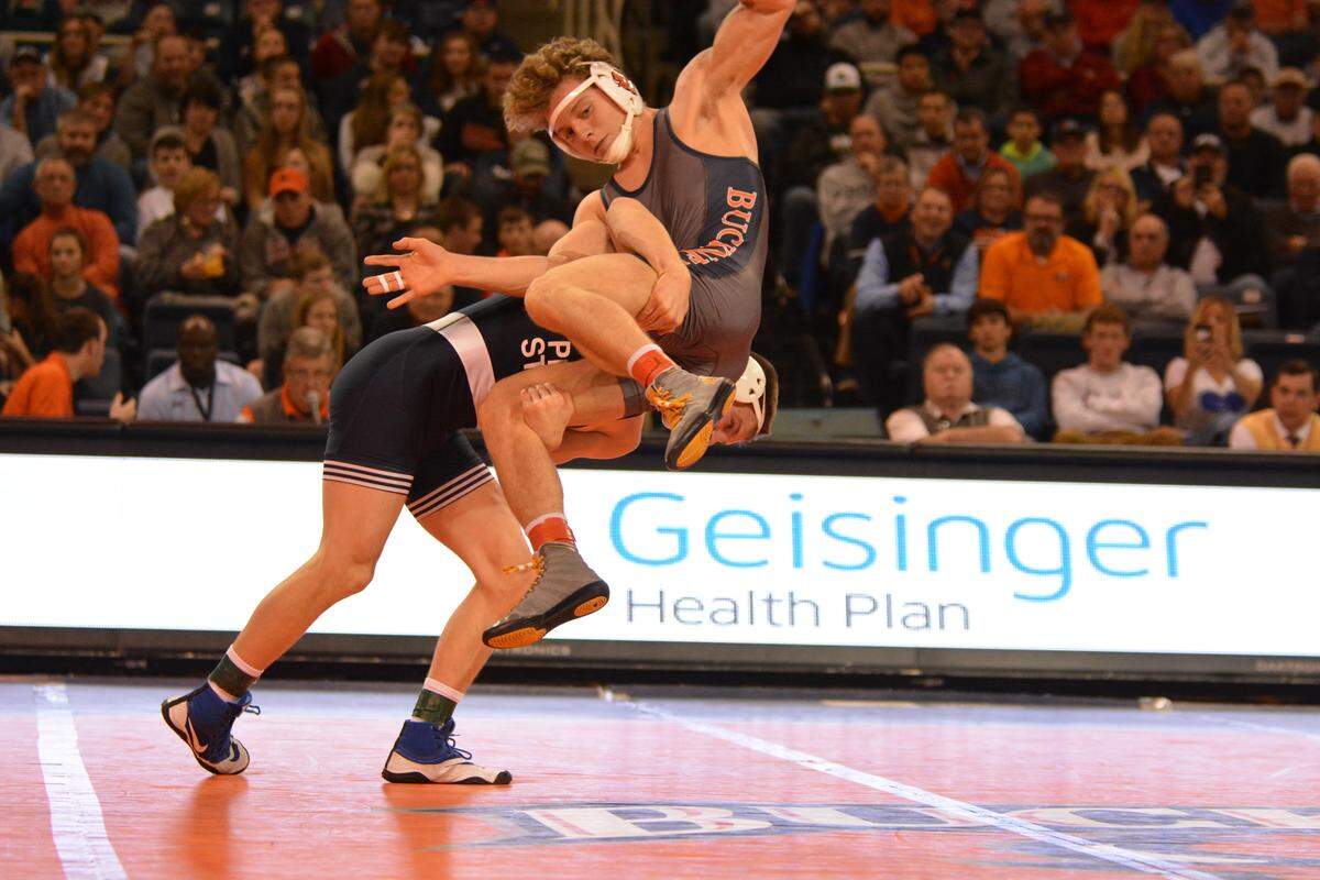 Penn State’s Jason Nolf scores a takedown on Bucknell’s Zach Hartman during their 157-pound match of the Nittany Lions’ 42-3 win on Friday night. Nolf pinned Hartman in 3:49.