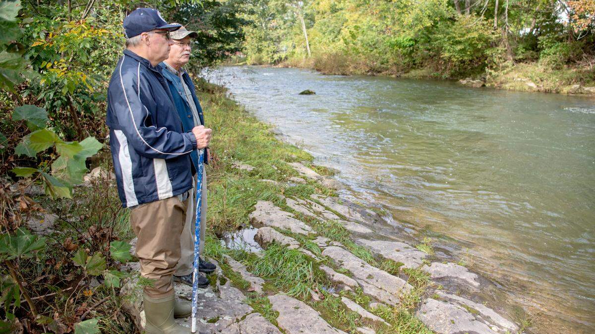 Centre County Pennsylvania Senior Environmental Corps volunteers Marty Nordberg and Doug Sassman look at Bald Eagle Creek on Thursday.