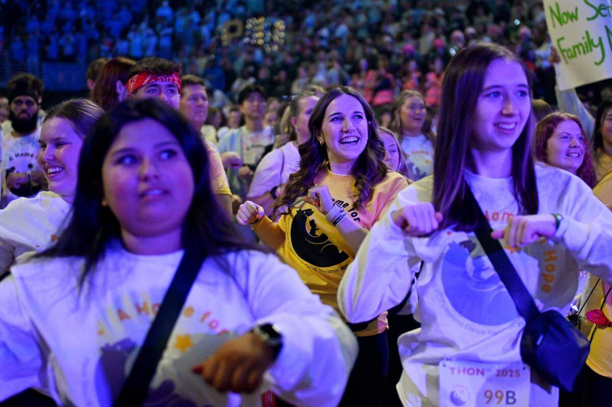 Volunteers and dancers learn the line dance during Penn State Thon on Friday, Feb. 21, 2025. The line dance is performed once an hour through the 46-hour event.