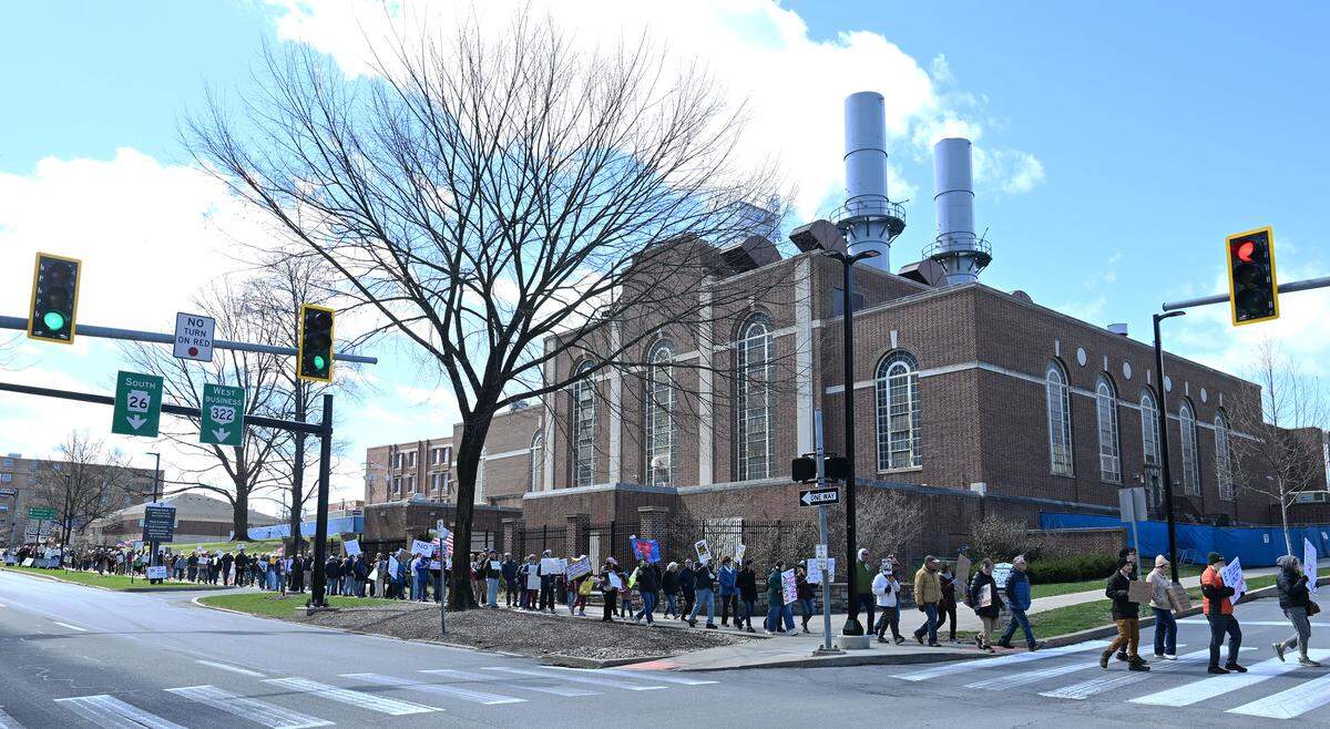 Protesters marched along College Avenue following a rally as part of the No Kings anti-Trump rally on Saturday.