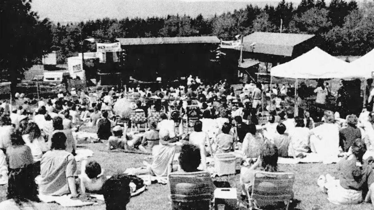 Fans of The Band and Kansas relax and listen to their music on a sunny day at Tussey Mountain on May 29, 1995.