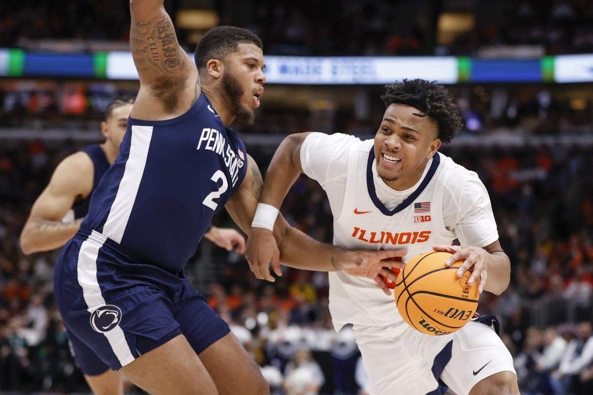 Illinois Fighting Illini guard Terrence Shannon Jr. (0) drives to the basket against Penn State Nittany Lions guard Myles Dread (2) during the second half at United Center.