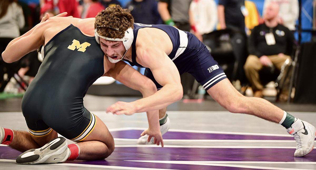 Penn State’s Mitchell Mesenbrink looks to finish off a takedown on Michigan’s Beau Mantanona in their 165-pound semifinals match of the Big Ten championships on Saturday inside Welsh Ryan Arena in Evanston, Ill. Mesenbrink collected a 25-8 technical fall on Mantanona in 6:29.