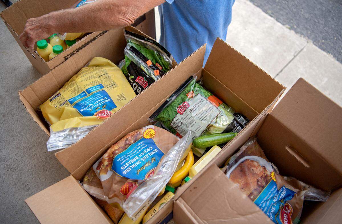 Chicken, vegetables and egg products were among the items community members received from the YMCA food distribution at the Howard United Methodist Church on Thursday, July 7, 2022.