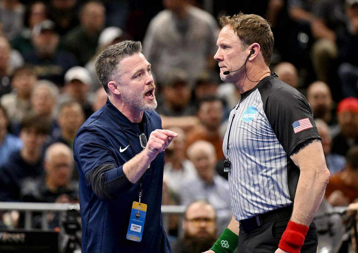 Penn State wrestling coach Cody Sanderson yells at a referee after PJ Duke fell to Oklahoma State’s Landon Robideau in a 157-pound semifinal bout of the NCAA wrestling championships on Friday, March 20, 2026.