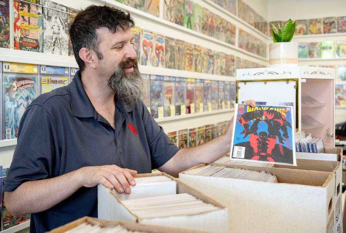 Justin Behrens talks about a Wolverine comic he has available at his shop Comic Cove on Monday, May 20, 2024.