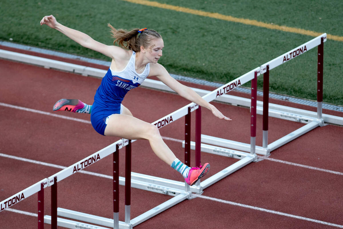 Saint Joseph’s Clare Marsh leads her heat of the 300 meter hurdles during the District 6 2A track meet at Mansion Park on Tuesday, May 18, 2021.