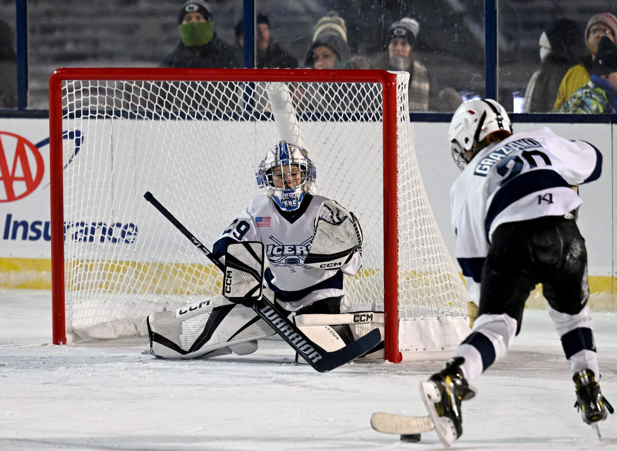 Cooper Graziano takes a shot on Ashton Schmitt as parents watch them play in Beaver Stadium on Wednesday, Jan. 28, 2026.