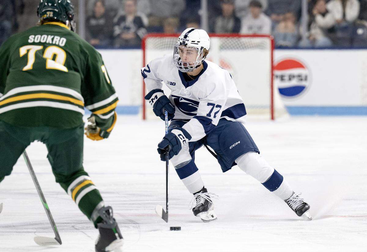 Penn State's Gavin McKenna skates with the puck around Clarkson defenders during the game on Thursday, Oct. 9, 2025. Clarkson won, 6-4.