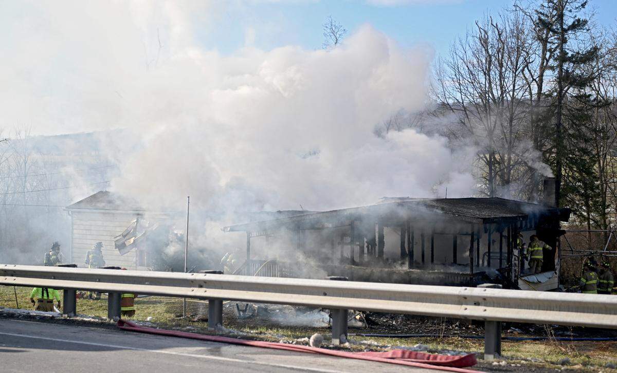 Firefighters respond to a fire at home on the 4000 block of Nittany Valley Drive in Walker Township on Tuesday, Dec. 20, 2022.