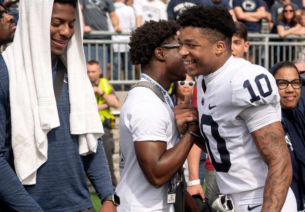 King Mack and Mehki Flowers greet each other after the Blue-White game on Saturday, April 15, 2023.