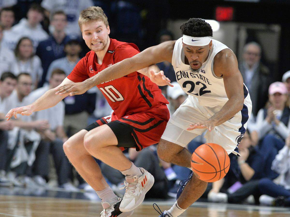 Rutgers’ Cam Spencer (10) and Penn State’s Jalen Pickett (22) go after the ball during the second half of an NCAA college basketball game, Sunday, Feb. 26, 2023, in State College.