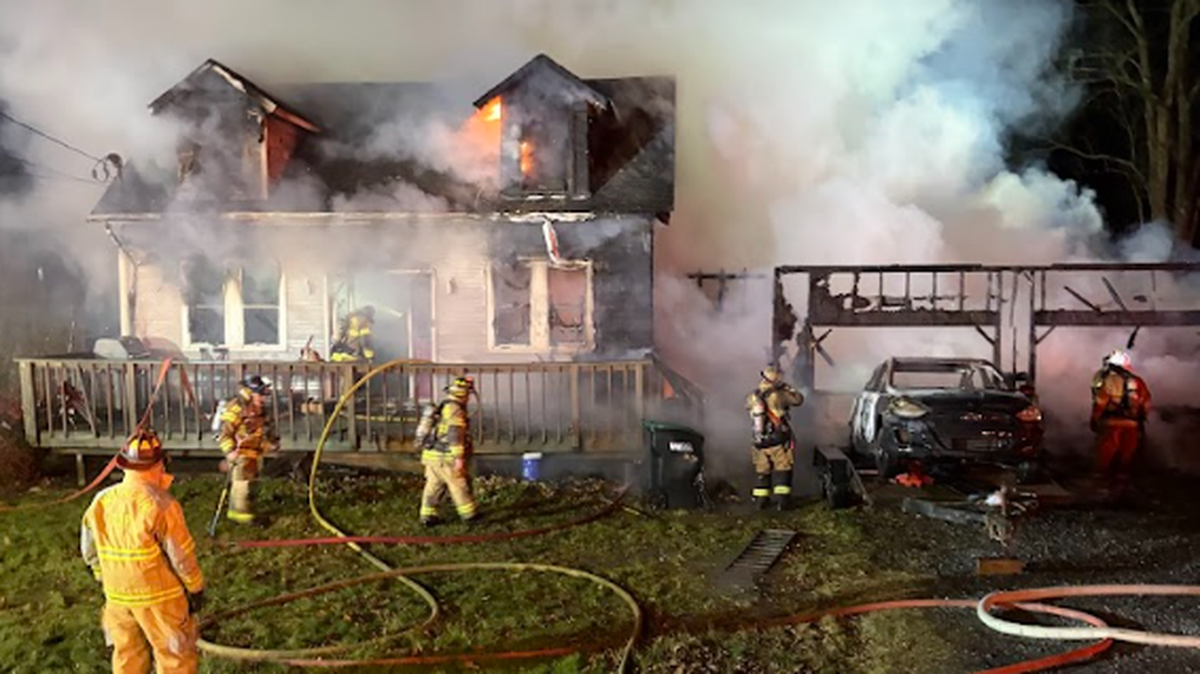 Fire companies battle an early morning house fire Monday in the 400 block of State Street in Rush Township.