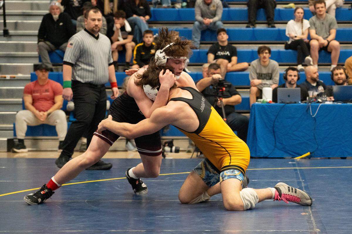State High's Teag Sanderson, left, with a collar tie looks to take down Thomas Jefferson's Zach Labryer during the Class 3A West Regional at Canon-McMillan High School in Strabane, Pa., on Saturday, Feb. 28, 2026.