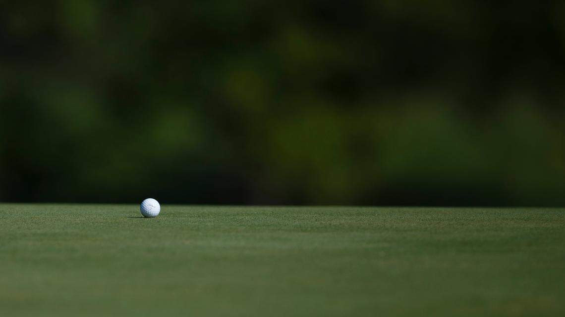 File photo of a golf ball on the green. A Pennsylvania man was sentenced to prison after officials say he stole $3.3 million worth of U.S Open Golf tournament tickets while working for the United States Golf Association.