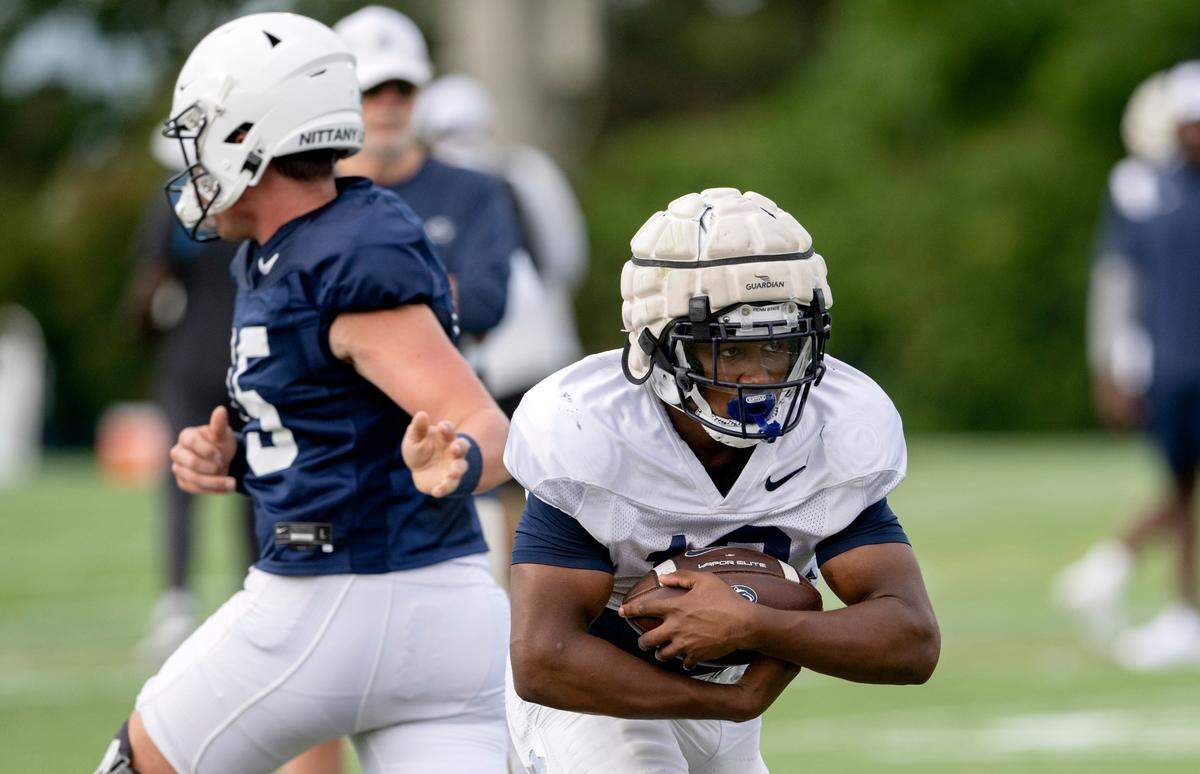 Penn State running back Nicholas Singleton runs with the ball during practice on Wednesday, Aug. 10, 2022.