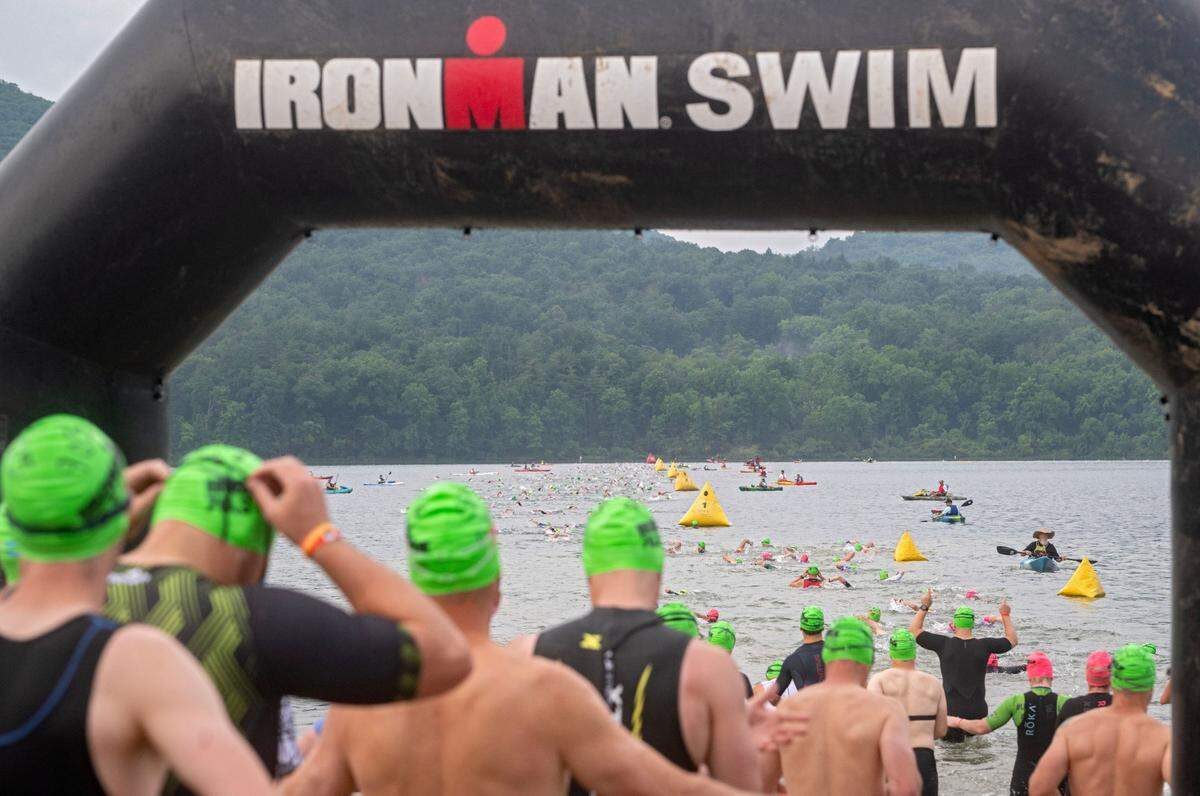 Athletes start their 1.2 mile swim in Foster Joseph Sayers Lake at Bald Eagle State Park for the Ironman 70.3 Pennsylvania Happy Valley on Sunday, June 30, 2024.