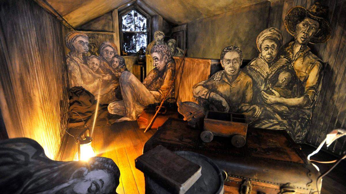 The Bellefonte Art Museum includes an exhibit by artist Lino Toyos in a room believed to have housed people along the Underground Railroad.