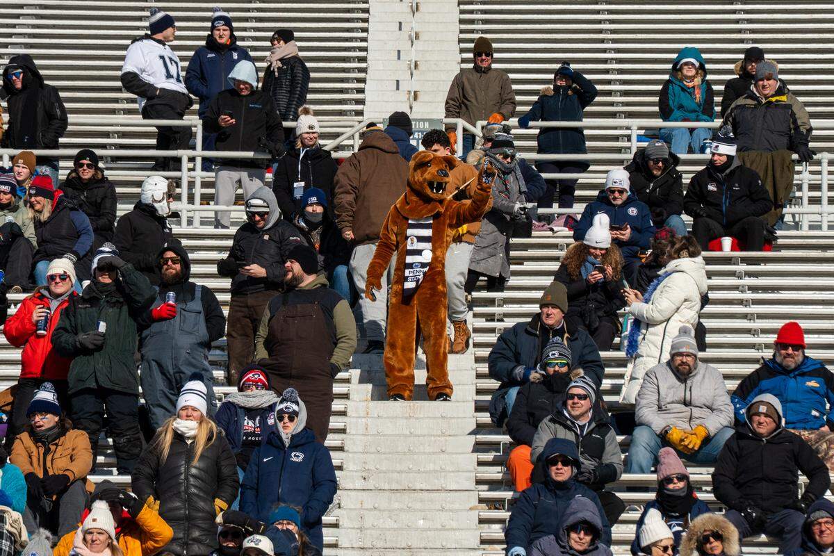 The Nittany Lion interacts with fans in the crowd during the Penn State women’s hockey game at Beaver Stadium on Friday, Jan. 30, 2026, in State College.