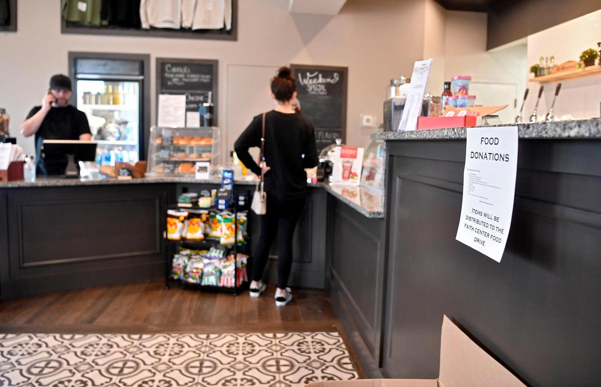 Customers can place takeout orders at Bonfatto’s Italian Market and Corner Cafe in Bellefonte Tuesday, March 17, 2020. There is also a place for patrons to leave food donations that will go to the Faith Centre.