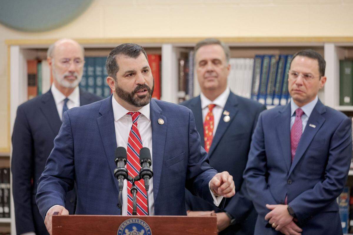 House Speaker Mark Rozzi, center, is shown here in 2019 with Gov. Tom Wolf, left, and Gov.-elect Josh Shapiro, right.