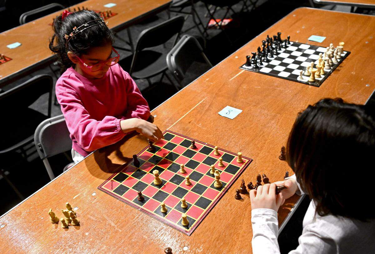 Two elementary students play during the State College Area School District chess tournament on Tuesday, Feb. 20, 2024.