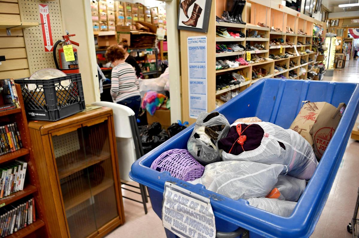 A tub of donations overflows into the hallway as volunteers try to sort through the items on Monday, May 18, 2020.