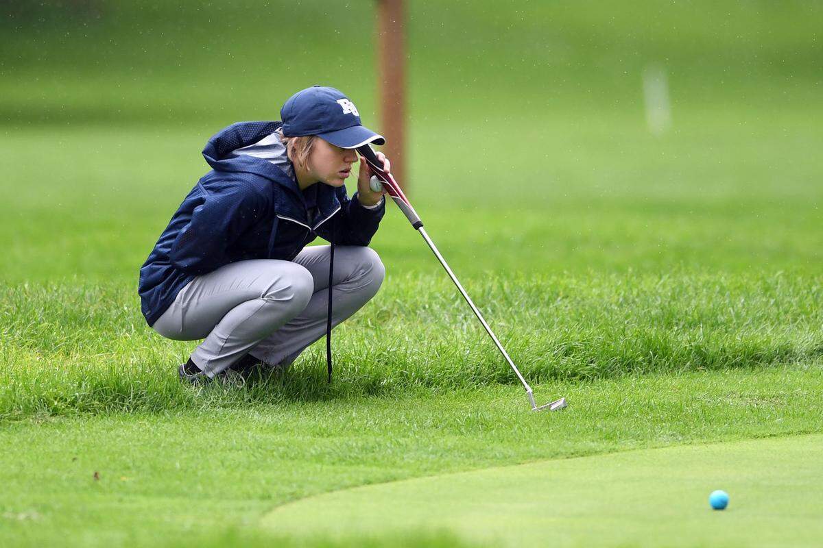 Philipsburg-Osceola’s Halle Herrington measures the distance from the ball to the hole before putting during a match Wednesday, Sept. 26, 2018 at the Nittany Country Club.
